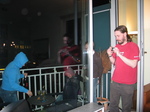 25027 Jenni, Laura, Dan and Brad on balcony of apartment.jpg